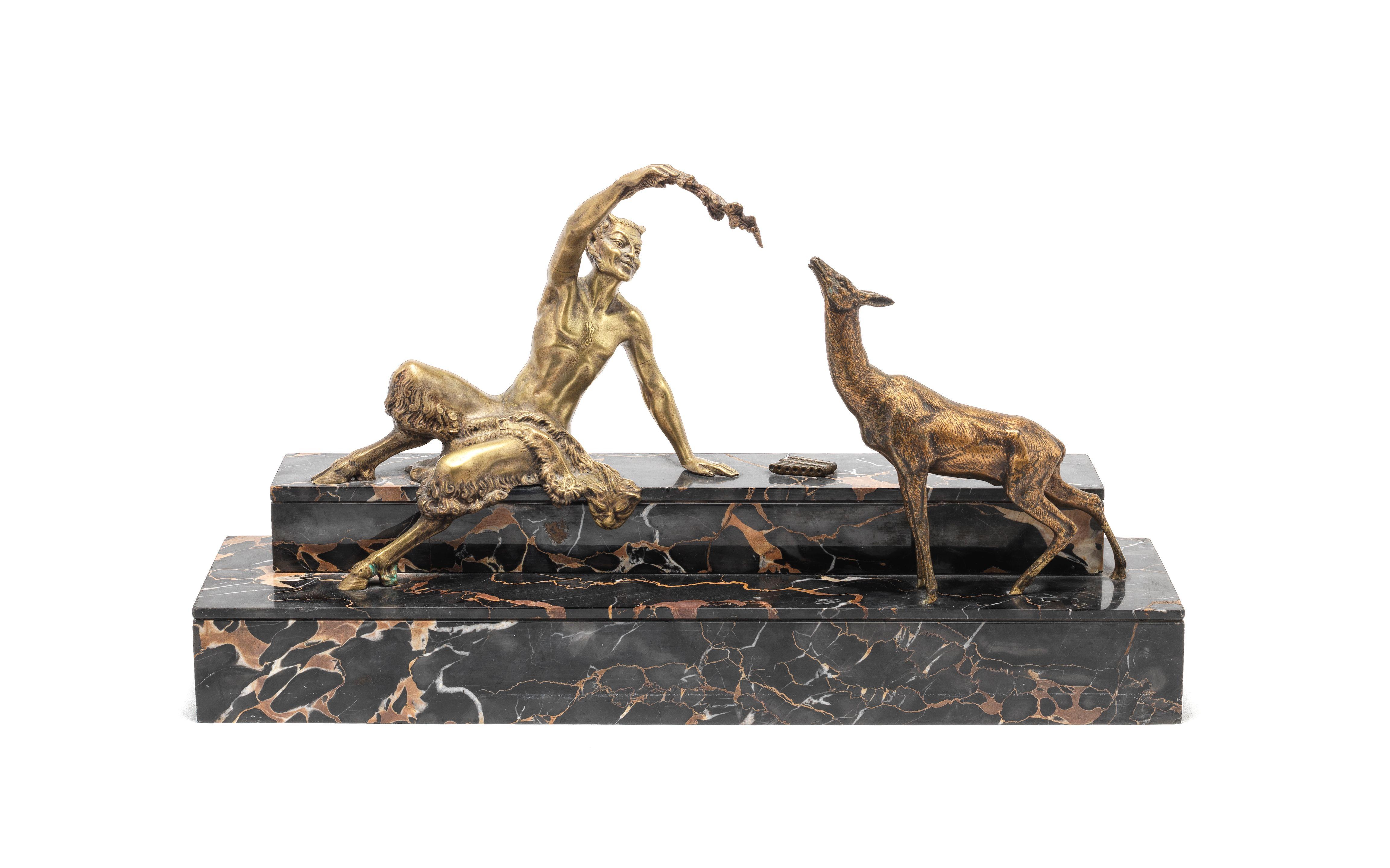 Marcel Andre Bouraine - A gilt and shaded bronze model of a satyr and faun