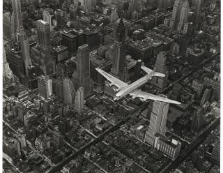 Margaret Bourke–White - A DC-4 Flying Over New York City, 1939