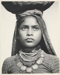 Margaret Bourke–White - Portrait of young girl carrying a basket on her head, India, 1948