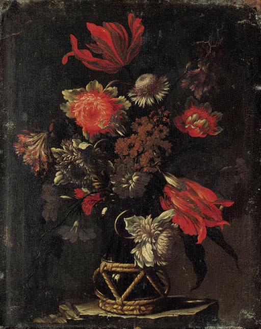 Mario Nuzzi - Parrot tulips, chrysanthemums, a thistle, and other flowers in a vase on a stone ledge