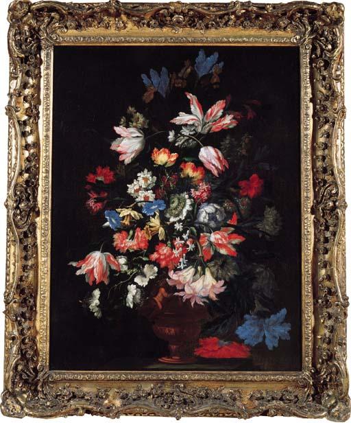 Mario Nuzzi - Tulips, carnations, chrysanthemums and other flowers in a sculpted vase on a stone ledge
