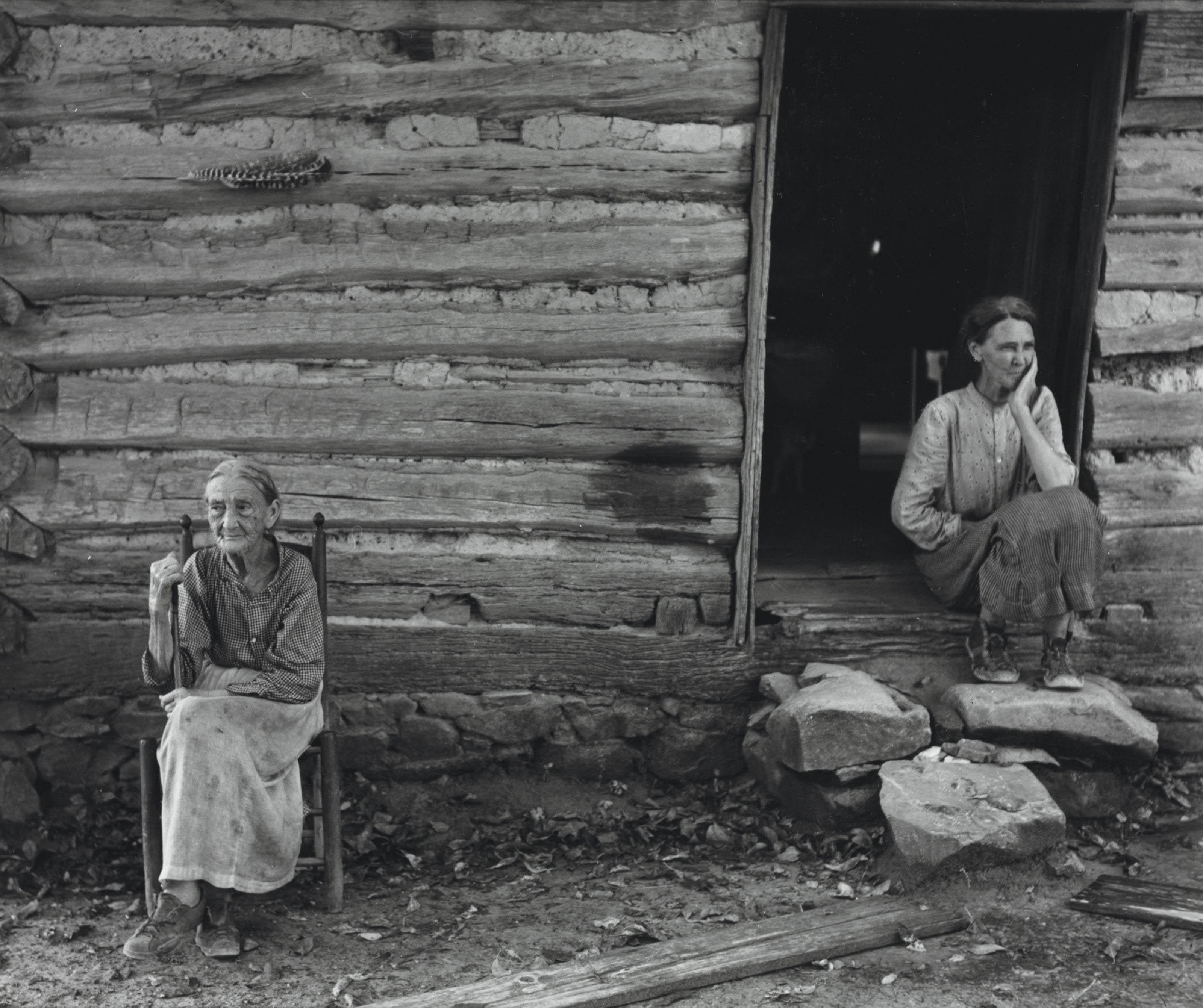Marion Post Wolcott - Mother and Daughter in Front of Log Cabin near Carboro, NC, 1939