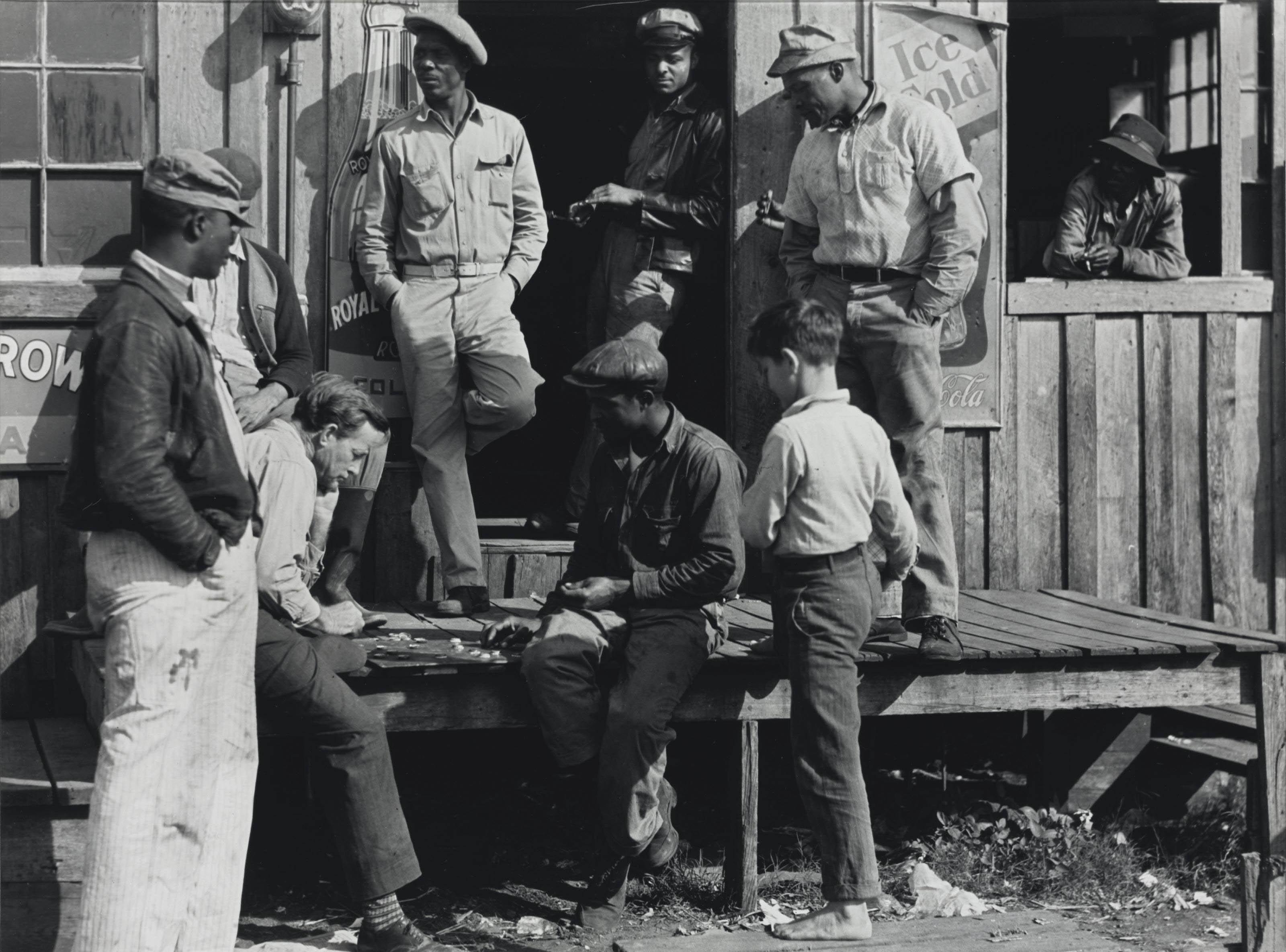 Marion Post Wolcott - Vegetable Pickers Playing Checkers in Front of a \'Jook Joint\', Belle Glade, Florida, February 1941