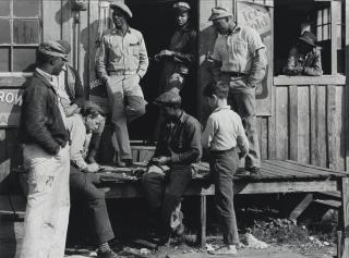 Marion Post Wolcott - Vegetable Pickers Playing Checkers in Front of a \'Jook Joint\', Belle Glade, Florida, February 1941
