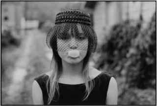 Mary Ellen Mark - Tiny Blowing a Bubble, Seattle (from Streetwise)