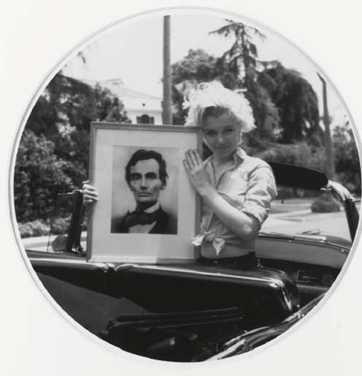 Milton Greene - Marilyn Monroe holding a portrait of Abraham Lincoln, 1950s