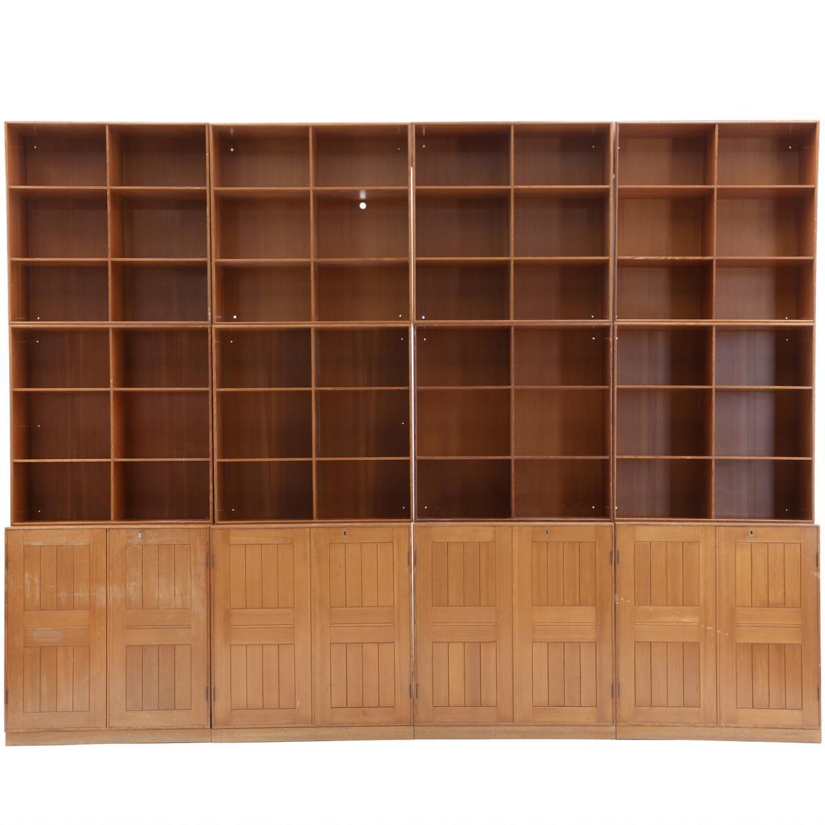 Mogens Koch - Wall unit of solid Oregon pine, consisting of four cabinets, eight bookcases and five plinths, cabinets and seven bookcases with brass fittings