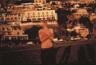 Nan Goldin - Pawel on the beach Laughing, Positano, 1996