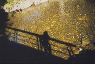 Nan Goldin - Self-Portrait On Bridge At Golden River At Silver Hill, 1998