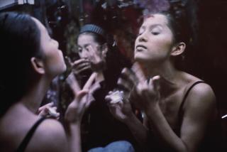 Nan Goldin - Yogo and C putting on make-up, Second Tip, Bangkok, 1992