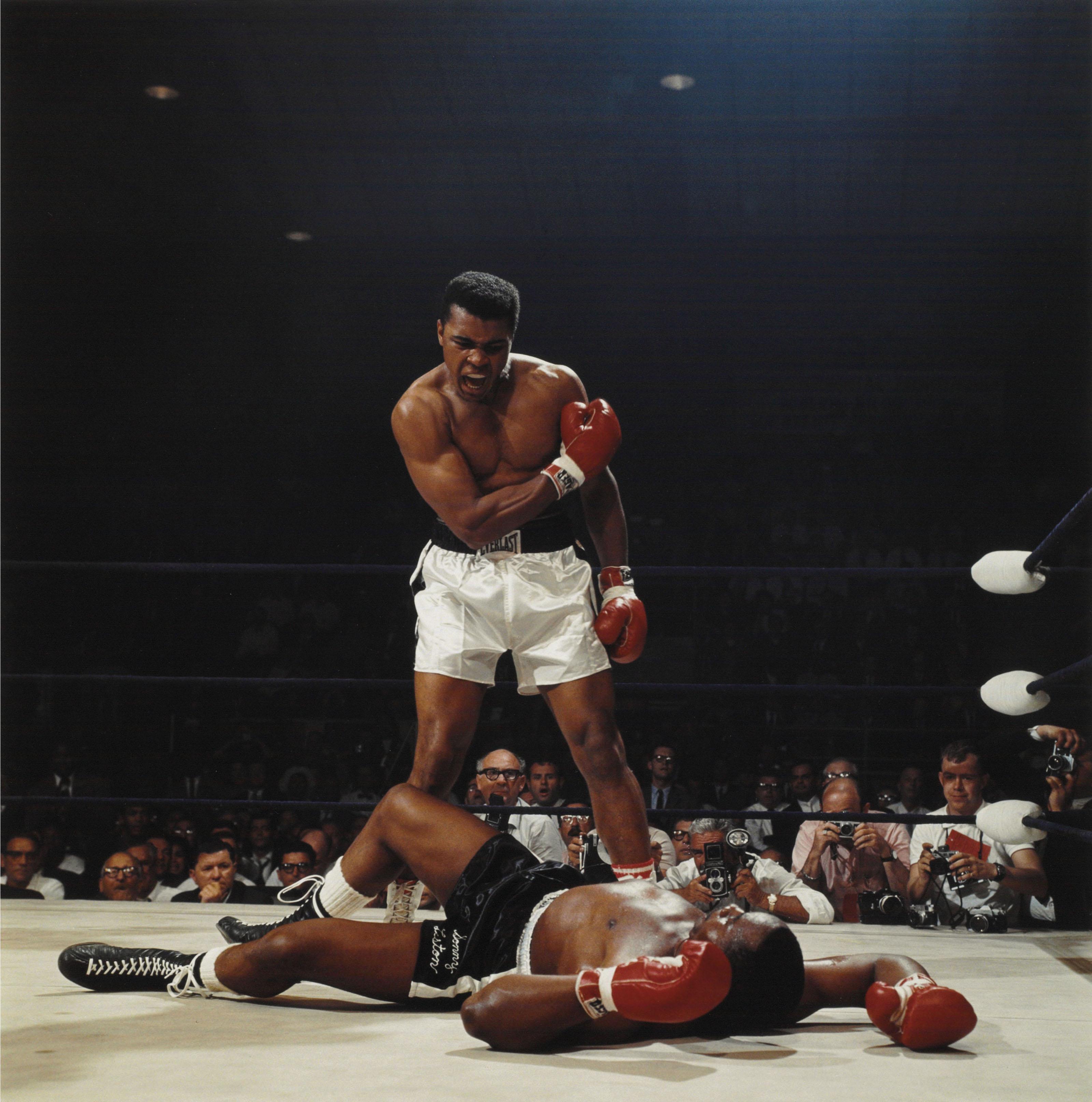 Neil Leifer - Muhammad Ali, first round knockout of Sonny Liston, St. Dominic’s Arena, Lewiston, Maine, 1965