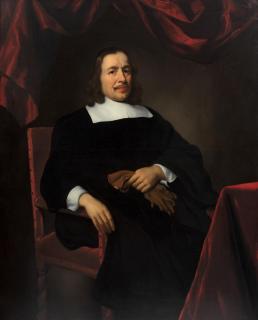Nicolaes Maes - Portrait of a gentleman, three-quarter-length, seated in a chair, before a red curtain