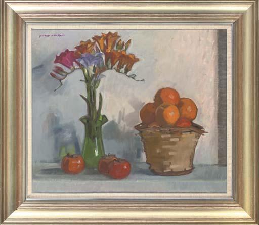 Norman Kirkham - Freesias in a glass vase, oranges in a wicker basket and sharon fruit to the side, on a table