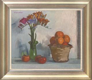 Norman Kirkham - Freesias in a glass vase, oranges in a wicker basket and sharon fruit to the side, on a table