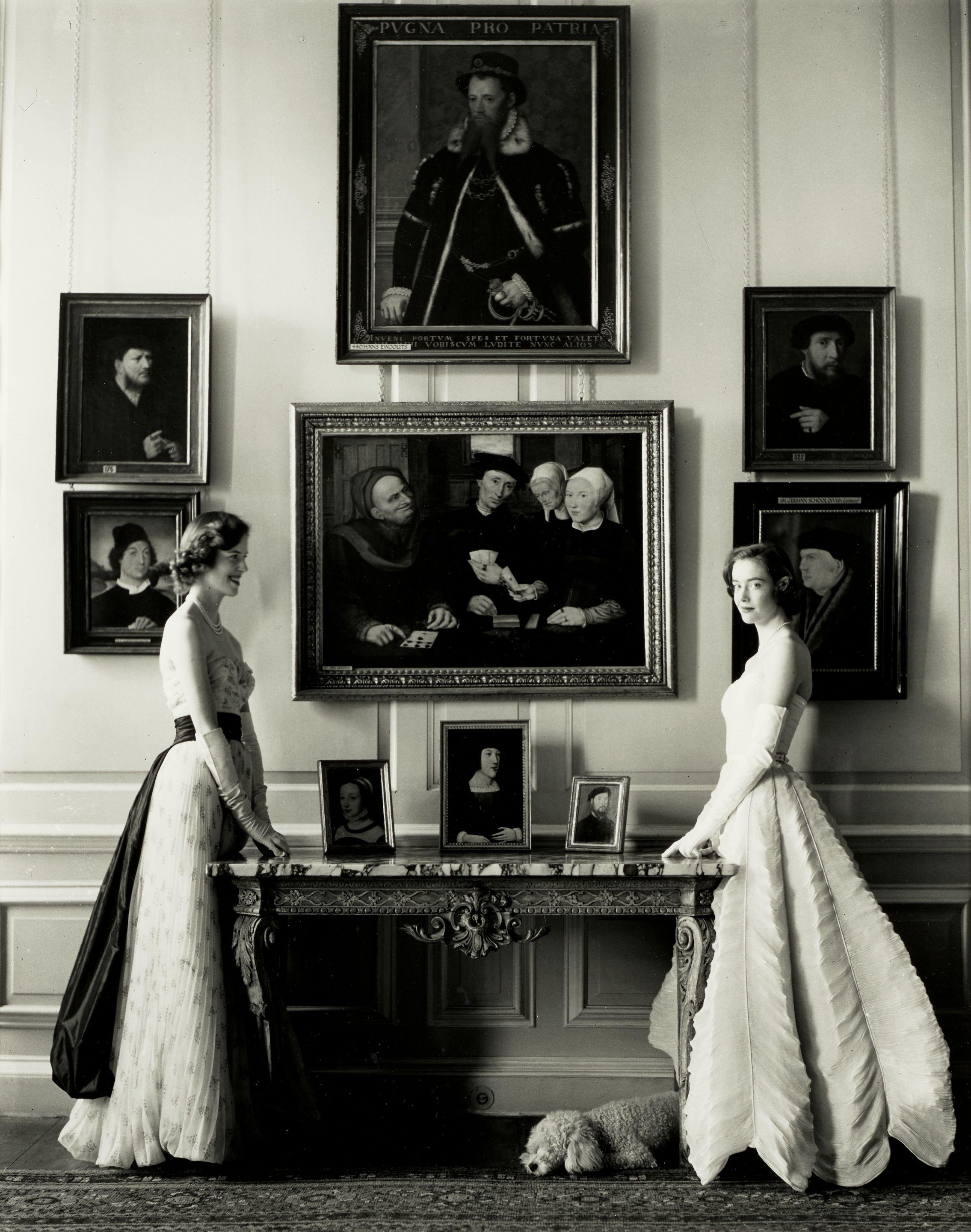Norman Parkinson - Lady Melissa and Lady Caroline Wyndham-Quin posing in Sybil Connolly dresses, the Little Dining Room, Petworth House