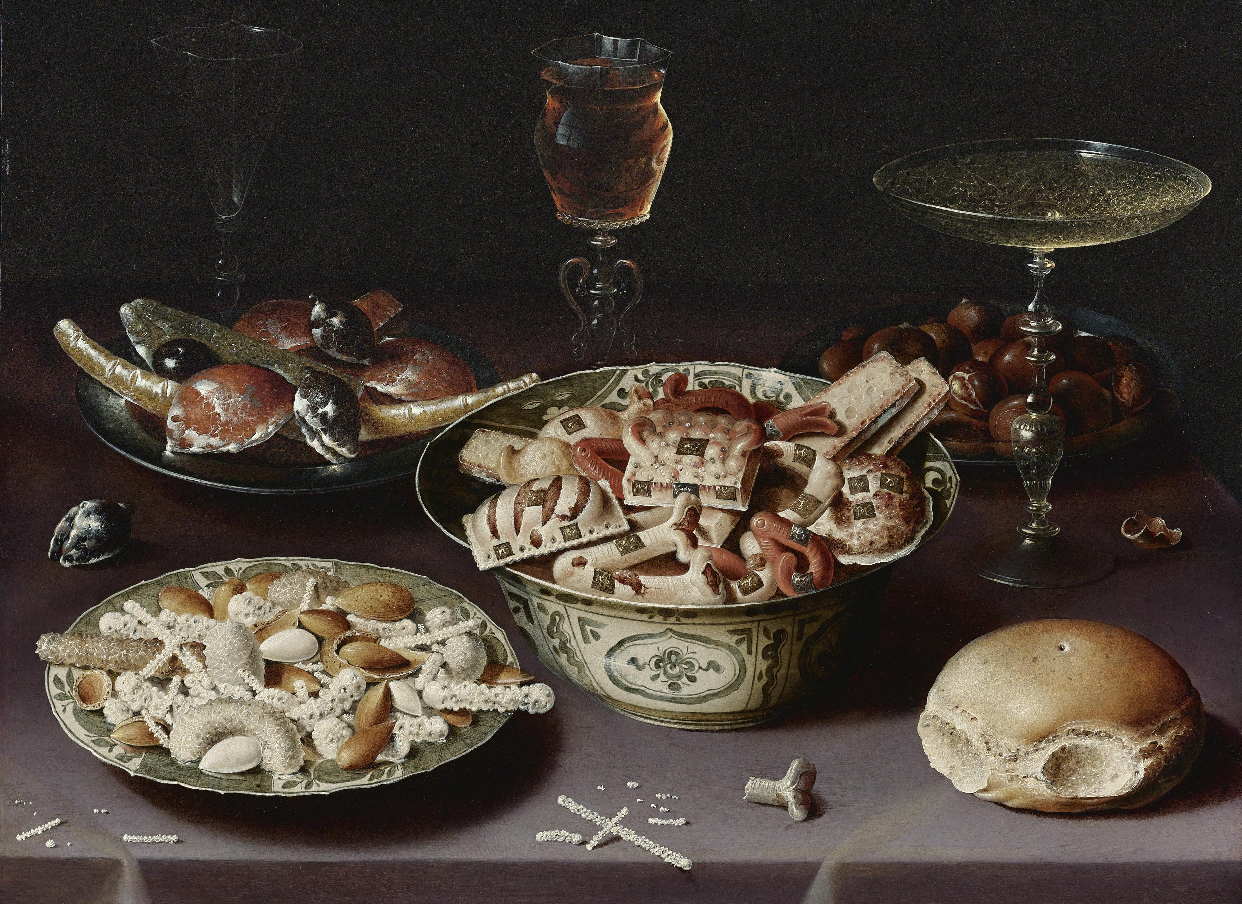 Osias Beert The Elder - A Still Life Of Porcelain Vessels Containing Sweets, Pewter Plates Bearing Sweets And Chestnuts, Three Pieces Of Glassware And A Bread Roll On A Table Draped With A Mauve Cloth