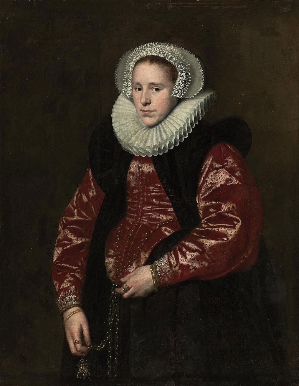 Paulus Moreelse - Portrait of a lady, half-length, in a lace bonnet, ruff, red gown with a black velvet mantle, holding a jewelled gold pomander