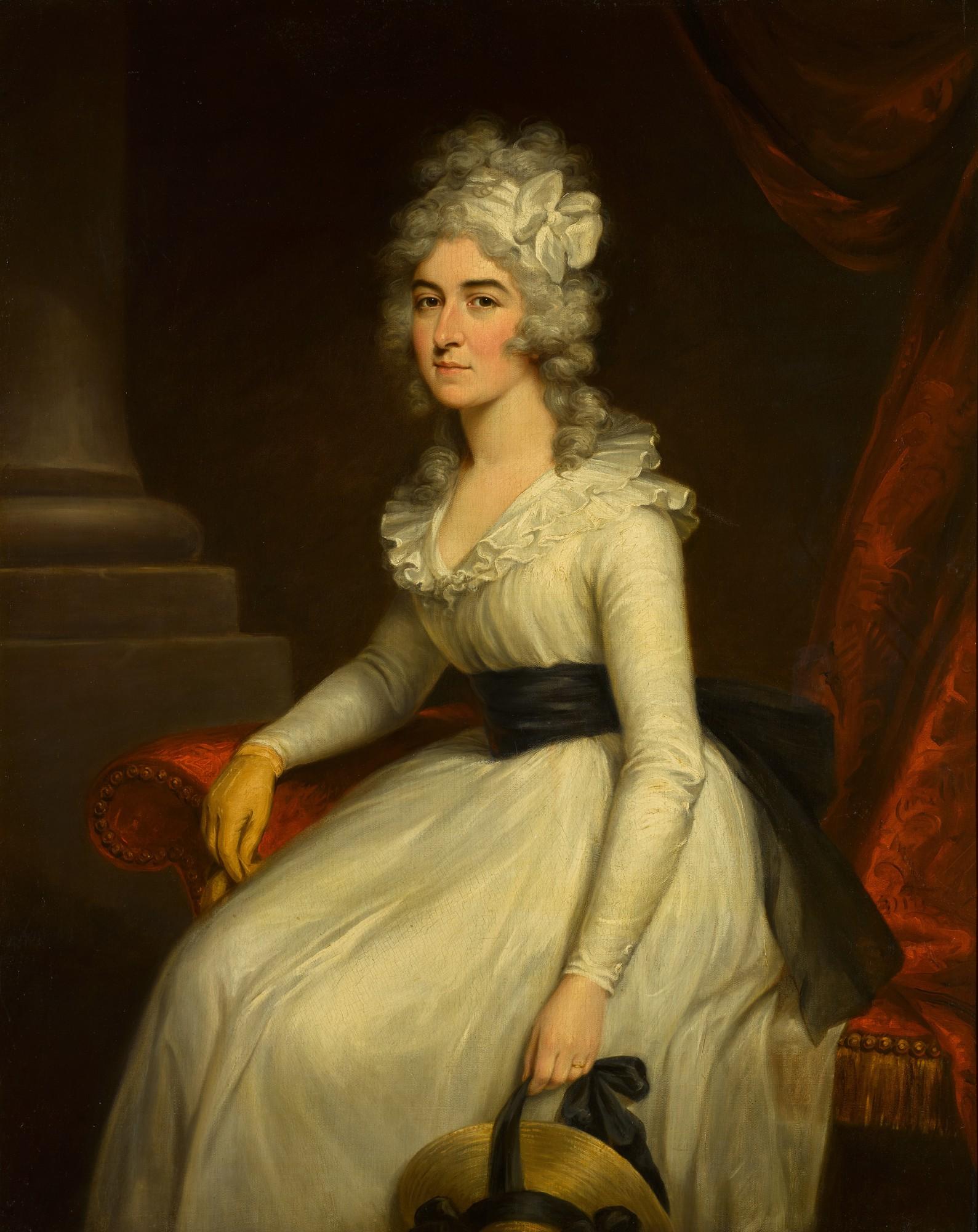 Philip Jean - Portrait of Mrs Bryan Barrett (1759–1834), three-quarter-length, seated, wearing a white dress with a black sash and a yellow leather glove, holding a straw hat
