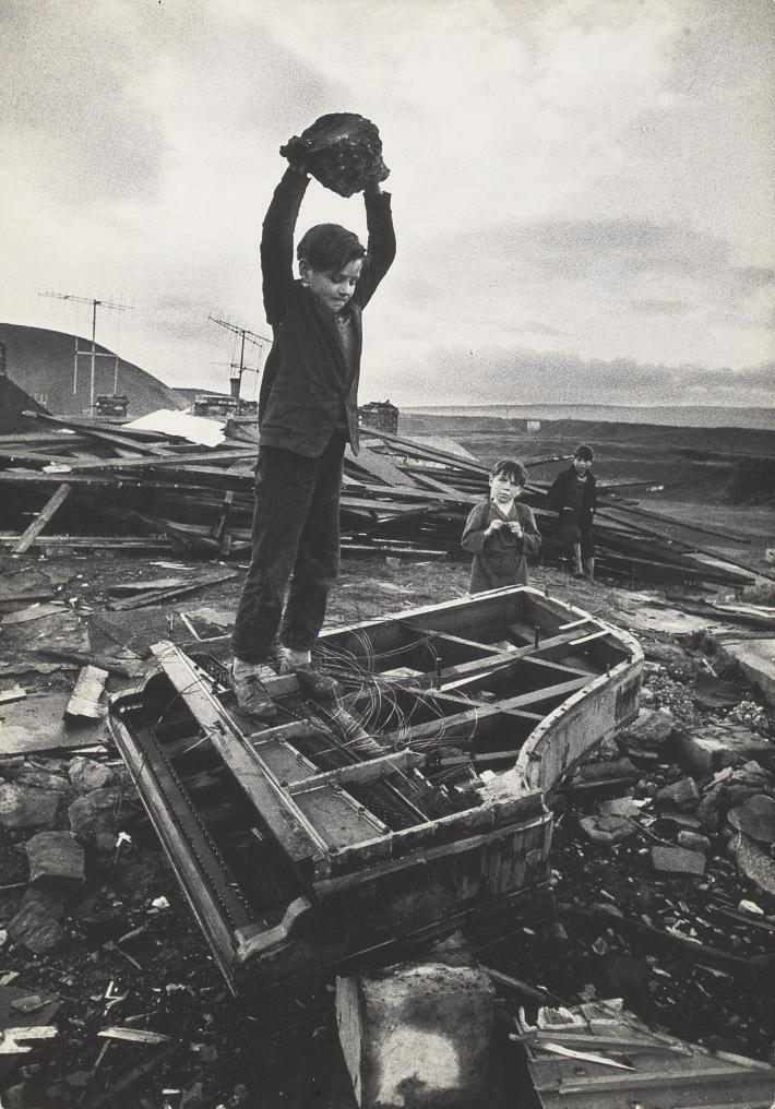 Philip Jones Griffiths - Boy Breaking Piano in South Wales Village, 1961