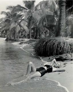 Philippe Halsman - Untitled (Girl Lying at Beach Edge), c. 1940-42
