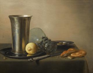 Pieter Claesz. - Still Life With A Silver Beaker And An Overturned Roemer, With Bread, A Knife And A Lemon And Olives On Two Pewter Plates