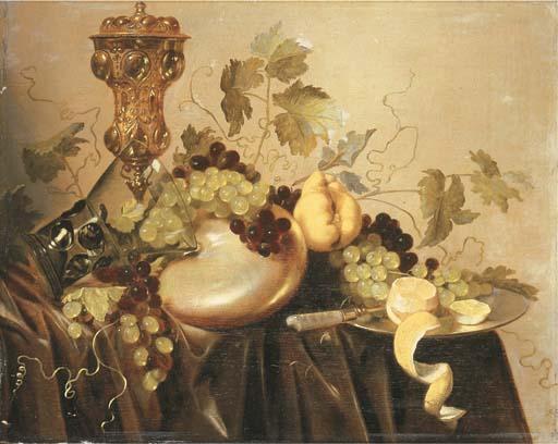 Pieter Nason - A silver-gilt cup and cover, an upturned roemer resting on a nautilus shell, grapes on the vine and a partly-peeled lemon with a knife on a silver plate on a draped table