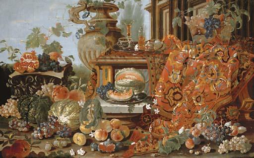 Pietro Navarra - Melons, Grapes, Peaches And Figs On The Ground And A Corinthian Capital, A Glass And Flask On A Pewter Tray And Fruit In A Glass Bowl, All Atop A Carpet Set On A Marble Ledge With A Classical Building Beyond