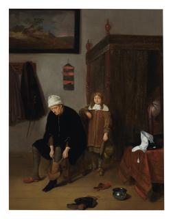Quiringh Gerritsz. Van Brekelenkam - Interior With A Gentleman Pulling On His Boots, Attended By A Page