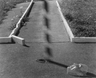 Ralph Eugene Meatyard - Untitled (Mask lying on sidewalk)