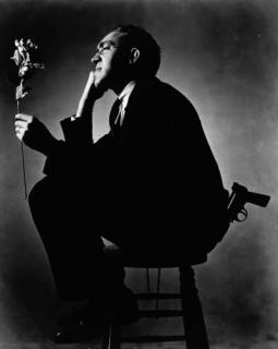 Ralph Steiner - S.J. Perlman with gun and rose (1935)