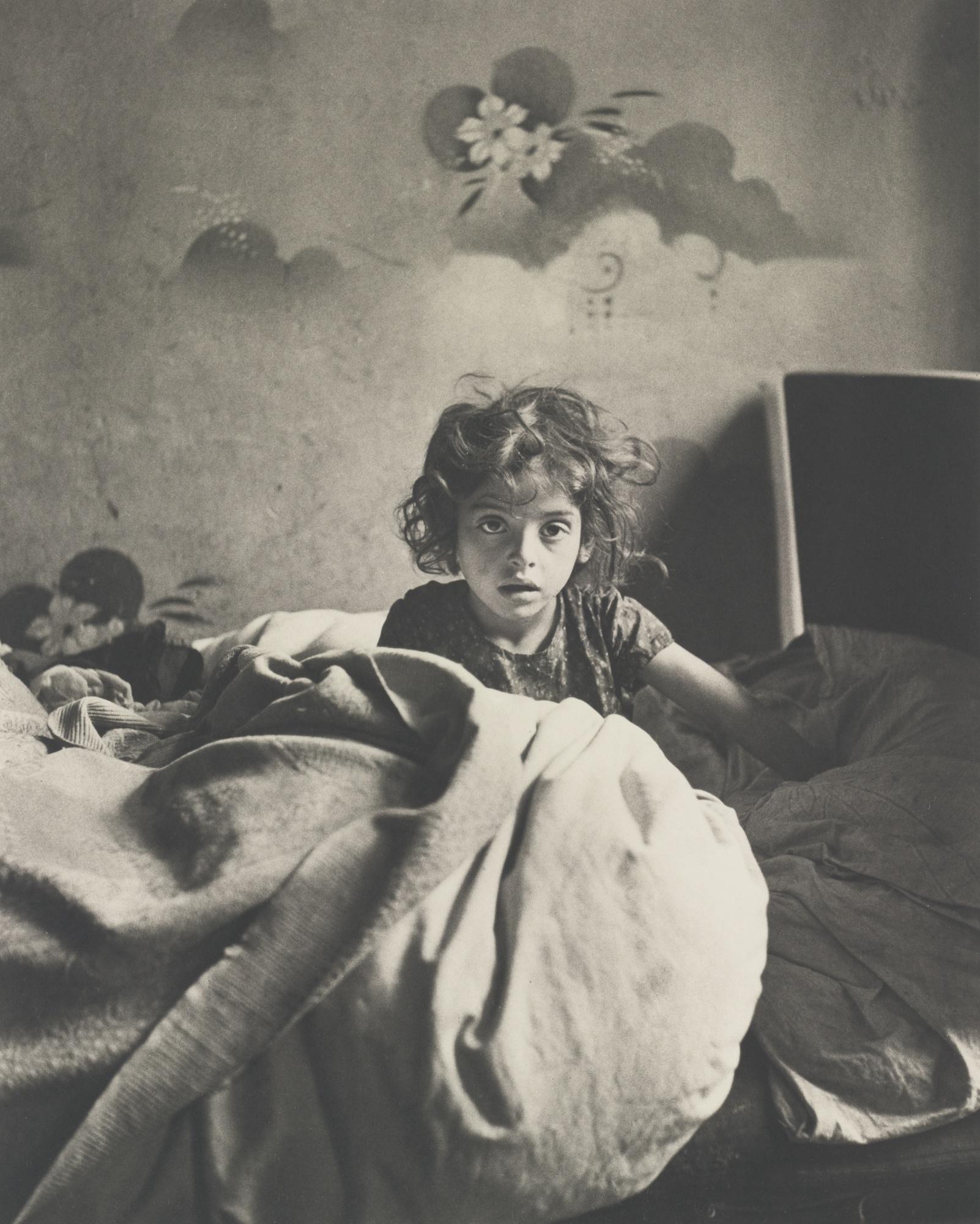 Roman Vishniac - Sara, Sitting In Bed In Basement Dwelling, With Stenciled Flowers Above Her Head, Warsaw