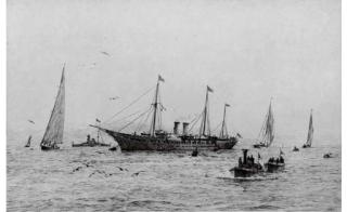 Rowland Langmaid - The Royal yacht Victoria and Albert (III) at Cowes, the guardship beyond