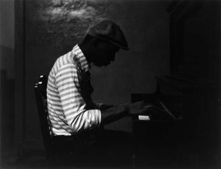 Roy Decarava - Man in Striped Shirt at Piano