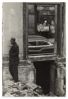Roy DeCarava - Man Standing Outside of a Building