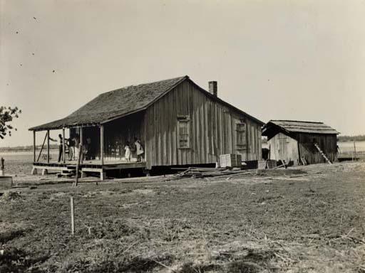 Russell Lee - Family and Their Old Home, c. 1937; and Untitled (Store facades), 1936