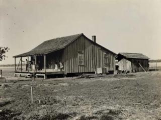 Russell Lee - Family and Their Old Home, c. 1937; and Untitled (Store facades), 1936