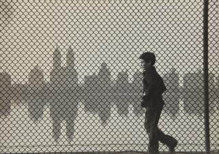 Ruth Orkin - \'Central Park Reservoir, Boy + Fence\'