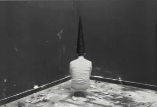 Santiago Sierra - Hooded Woman Seated Facing The Wall