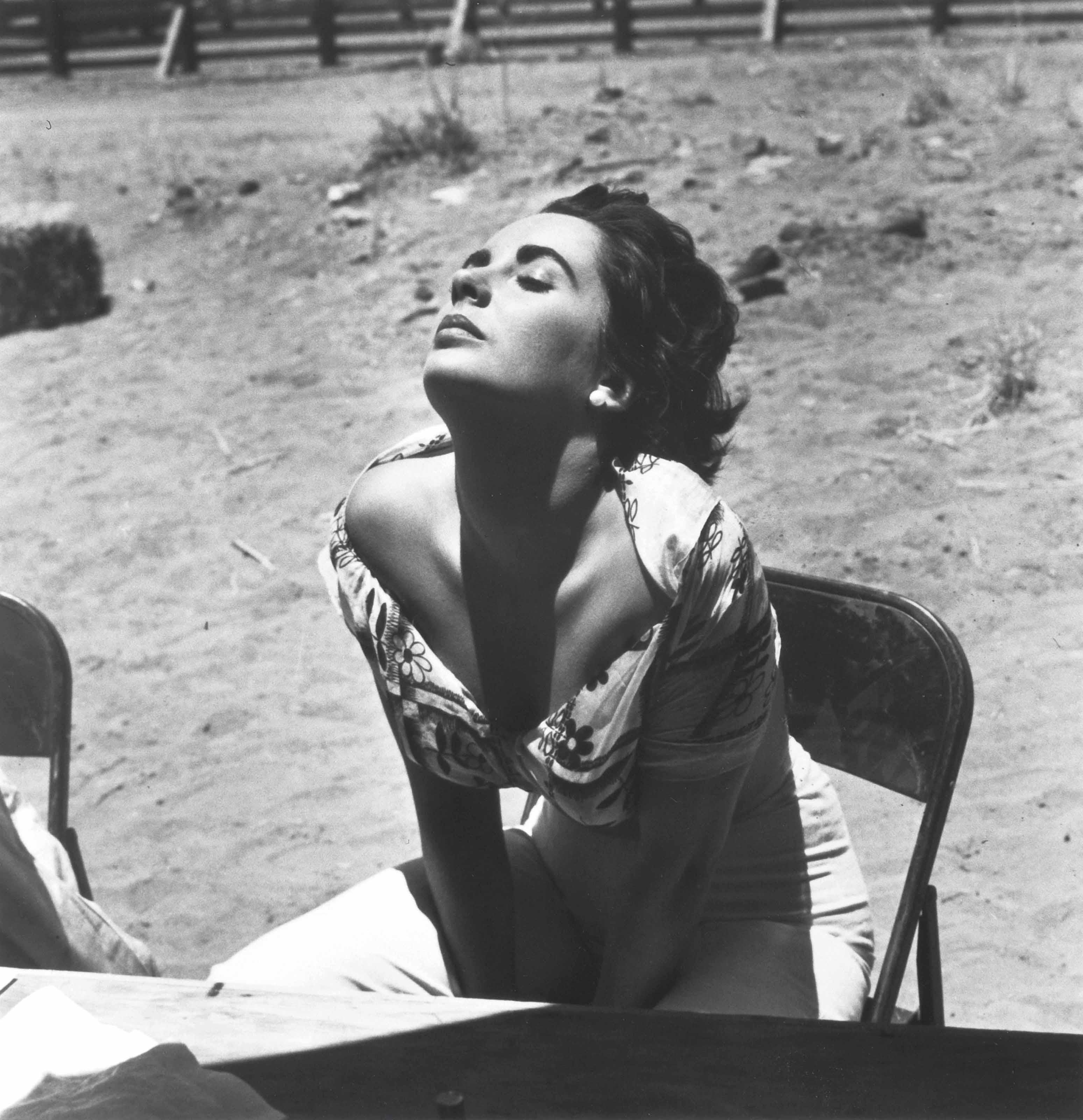 Sid Avery - Elizabeth Taylor sunning herself on the set of \'Giant\', Marfa, Texas, 1955