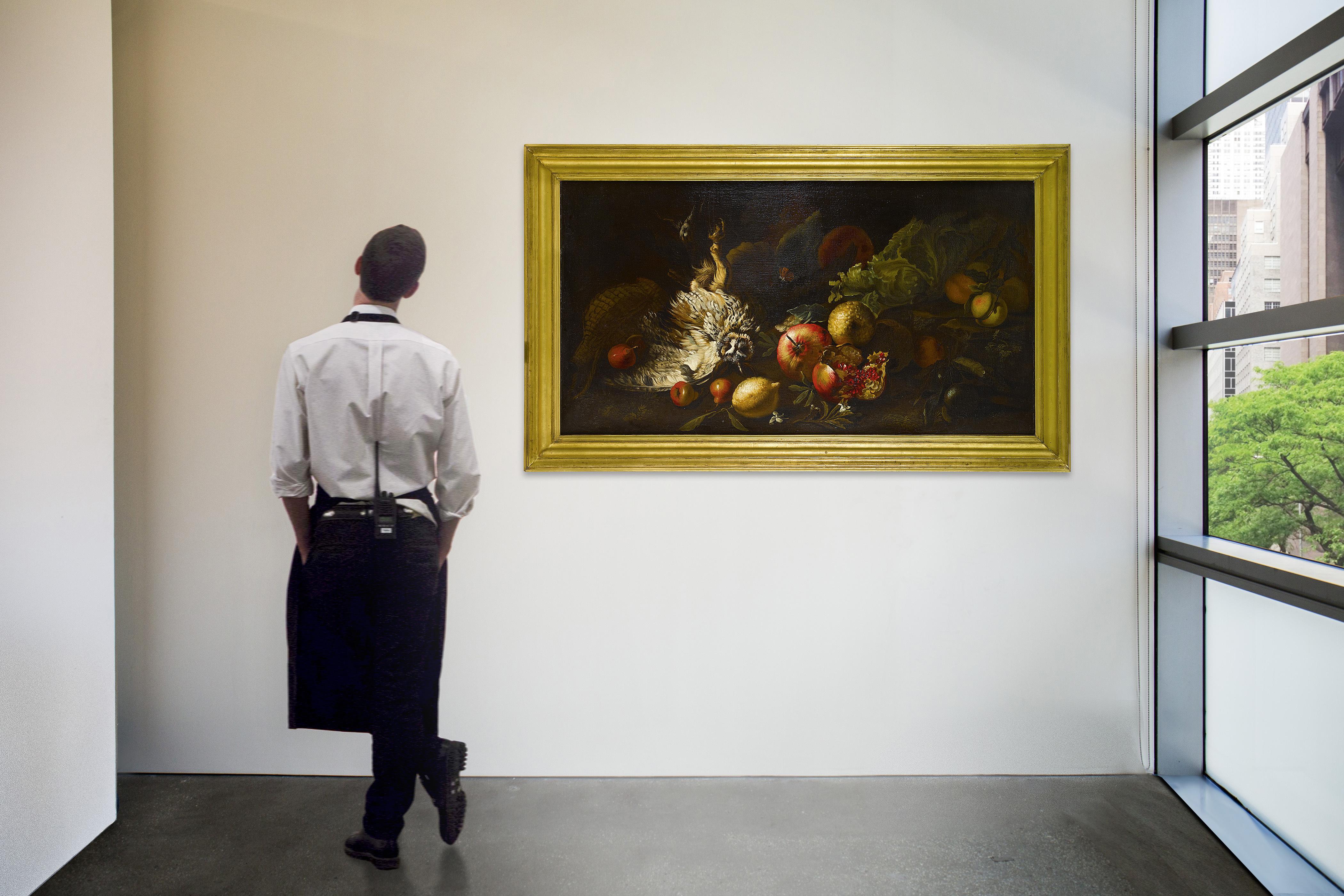 Simone Del Tintore - A Still Life With An Owl, Butterfly, White Lilies, Lettuce, Pomegranate, Onion, Lemon, Apple And Other Fruits