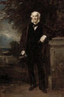 Sir Daniel Macnee, P.R.S.A. - Portrait of a gentleman, small full-length, in a black suit and brown coat, holding a cane and top hat in his right hand, resting against a plinth with an extensive landscape beyond