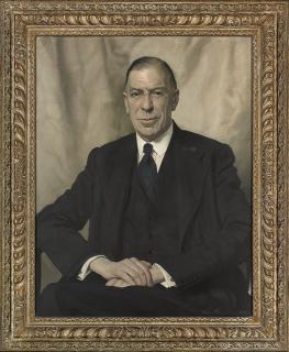 Sir Herbert James Gunn, R.A. - Portrait of Sir Eustace Ralph Pulbrook (1881-1953), seated half-length, in a blue three-piece suit