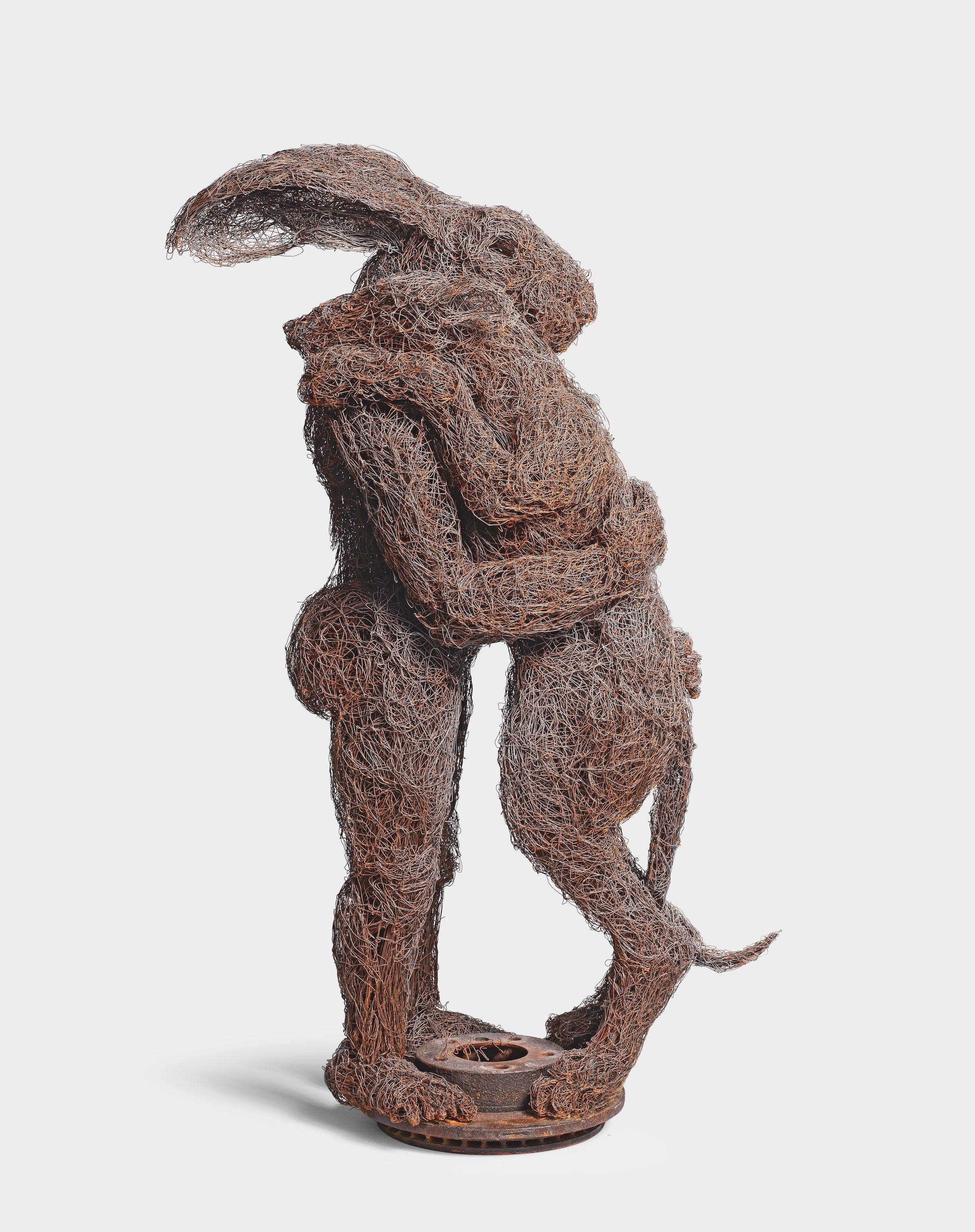 Sophie Ryder - Lady-Hare holding Dog