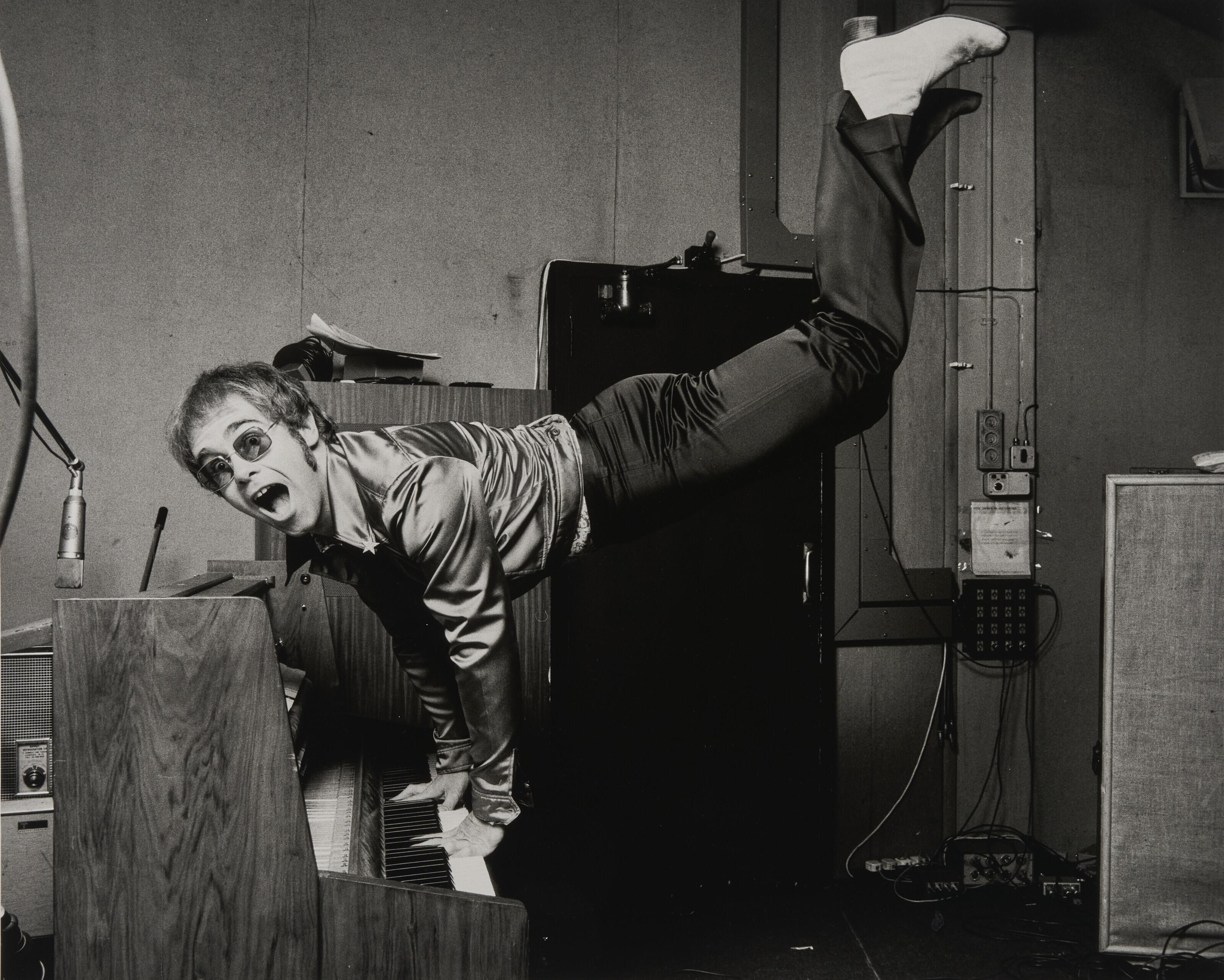 Terry O\'Neill - Elton John Performing a Handstand, 1972