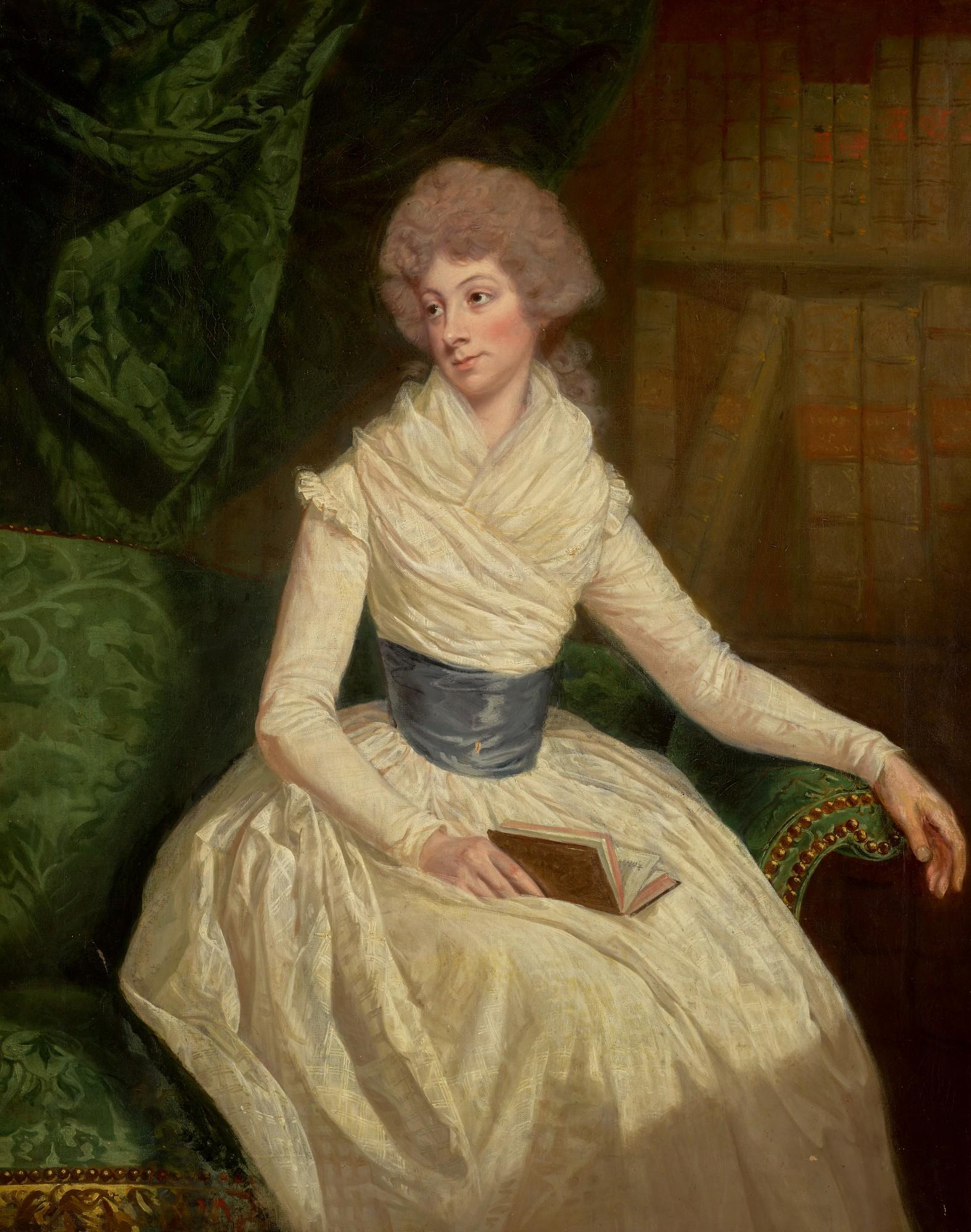 Thomas Beach, R.A. - Portrait Of Mrs Maria Anne Penrudokke, Three-Quarter-Length, In A White Dress And Blue Sash, Seated In A Library, Holding A Book