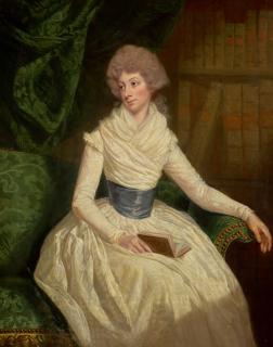Thomas Beach, R.A. - Portrait Of Mrs Maria Anne Penrudokke, Three-Quarter-Length, In A White Dress And Blue Sash, Seated In A Library, Holding A Book