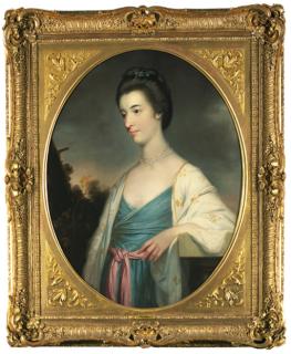 Tilly Kettle - Portrait of Mary Aubrey of Rathcoffey, Co. Kildare, three-quarter-length, in a blue dress and white embroidered wrap, her left arm resting on a stone plinth, in a landscape