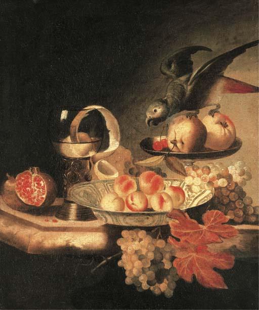 Tobias Stranover - A wanli-kraak porselein bowl of peaches, a peeled lemon in a roemer, apples and parakeet in a tazza and a pomegranate, grapes on a ledge