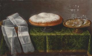 Tomás Hiepes - A lace-trimmed hand cloth, a pan dulce and glassware on a stand, all arranged upon a tabletop draped with green damask