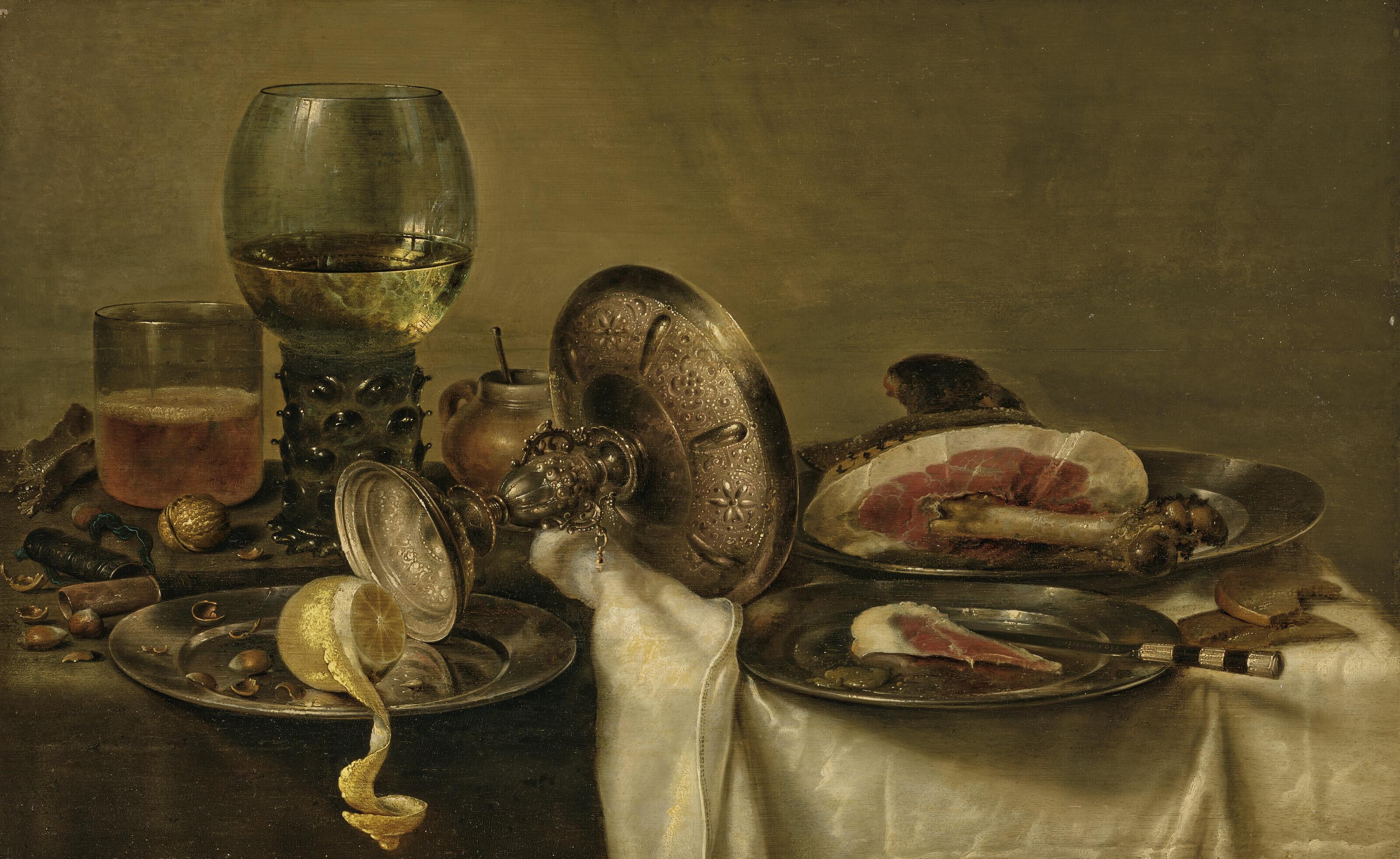 Willem Claesz. Heda - A partially draped table with an overturned tazza, roemer and glass of beer, with a partially peeled lemon and ham on pewter plates and other objects